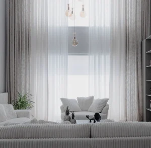 Phòng khách trắng, rèm voan cao kịch trần và sofa vải xám
